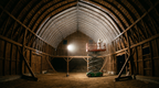 Radiant barrier reflective surface covering attic framing after paint application