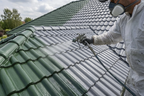 Tile roof color glaze and sealer, sprayed onto green and gray roof shingles